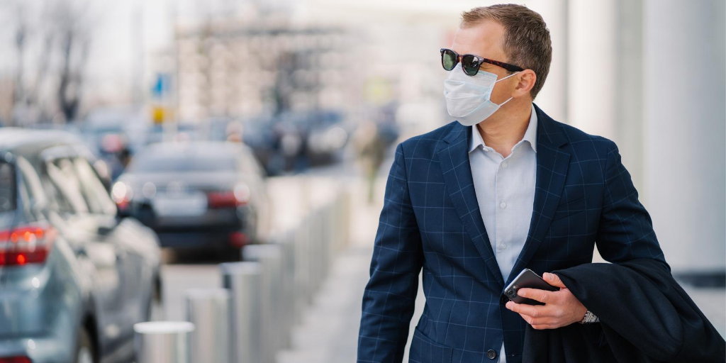 employee commuting and wearing a mask